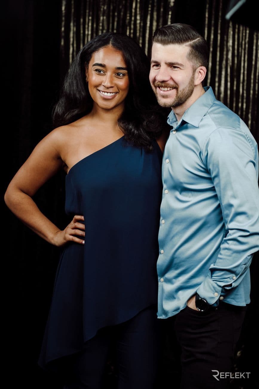 Couple posing against a shimmer backdrop for the Gatsby AI photo booth