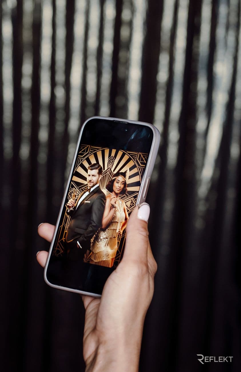 Phone showing a Gatsby-style AI portrait delivered from the photo booth