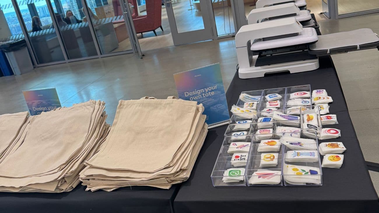 Trays of press-on designs at a design-your-own tote bar