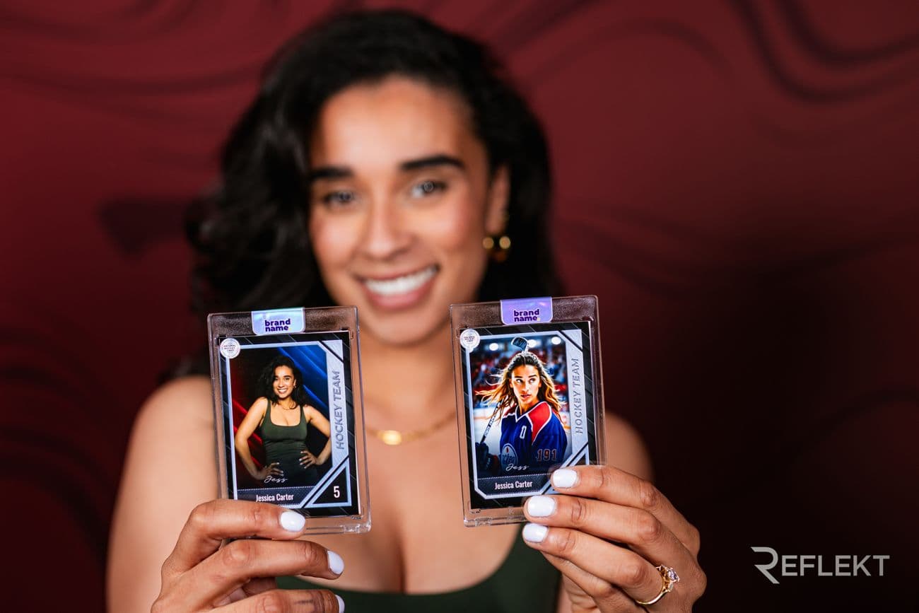 Guest holding two personalized trading cards printed live at an event