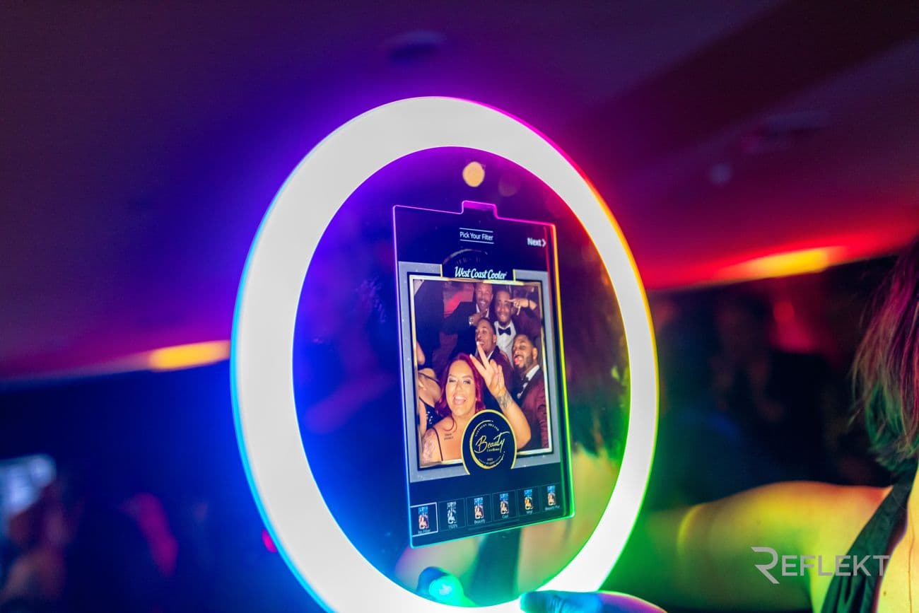 Roaming photo booth screen showing a group photo preview at a party